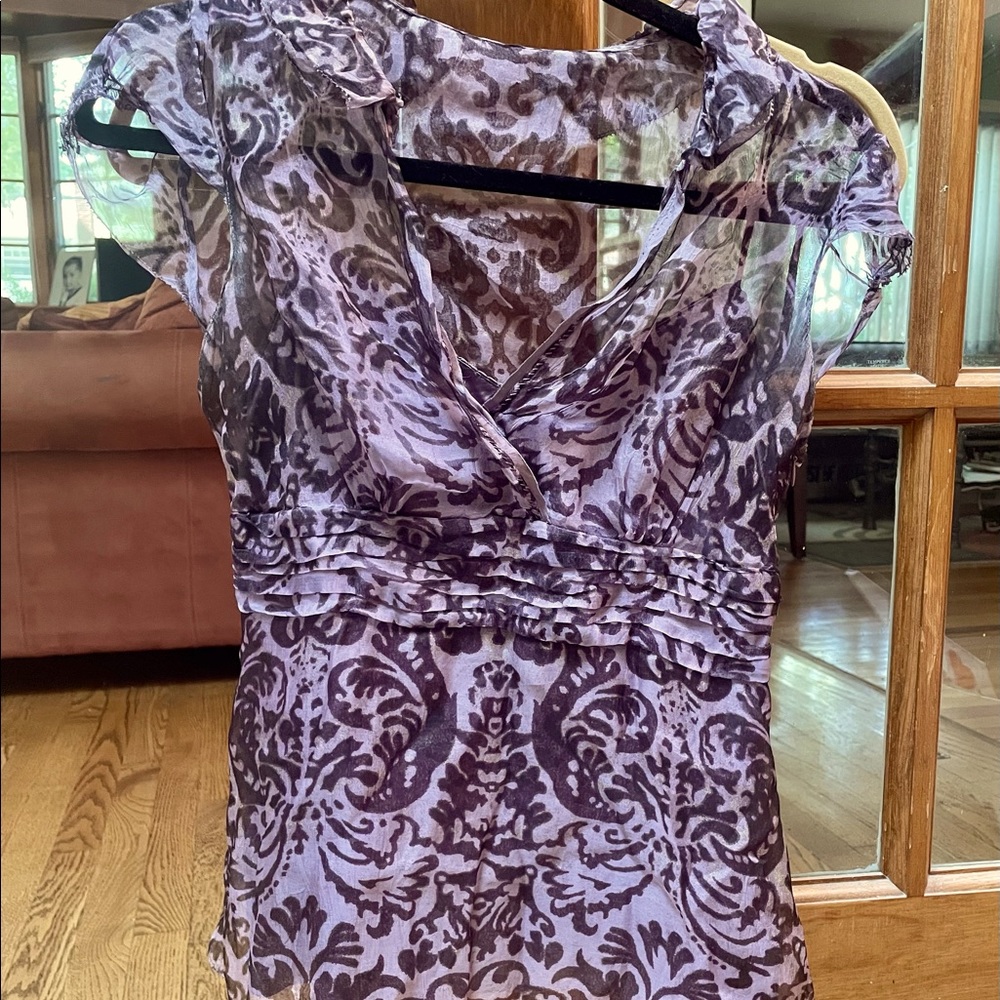 Ellie Tahari sheer V neck blouse.